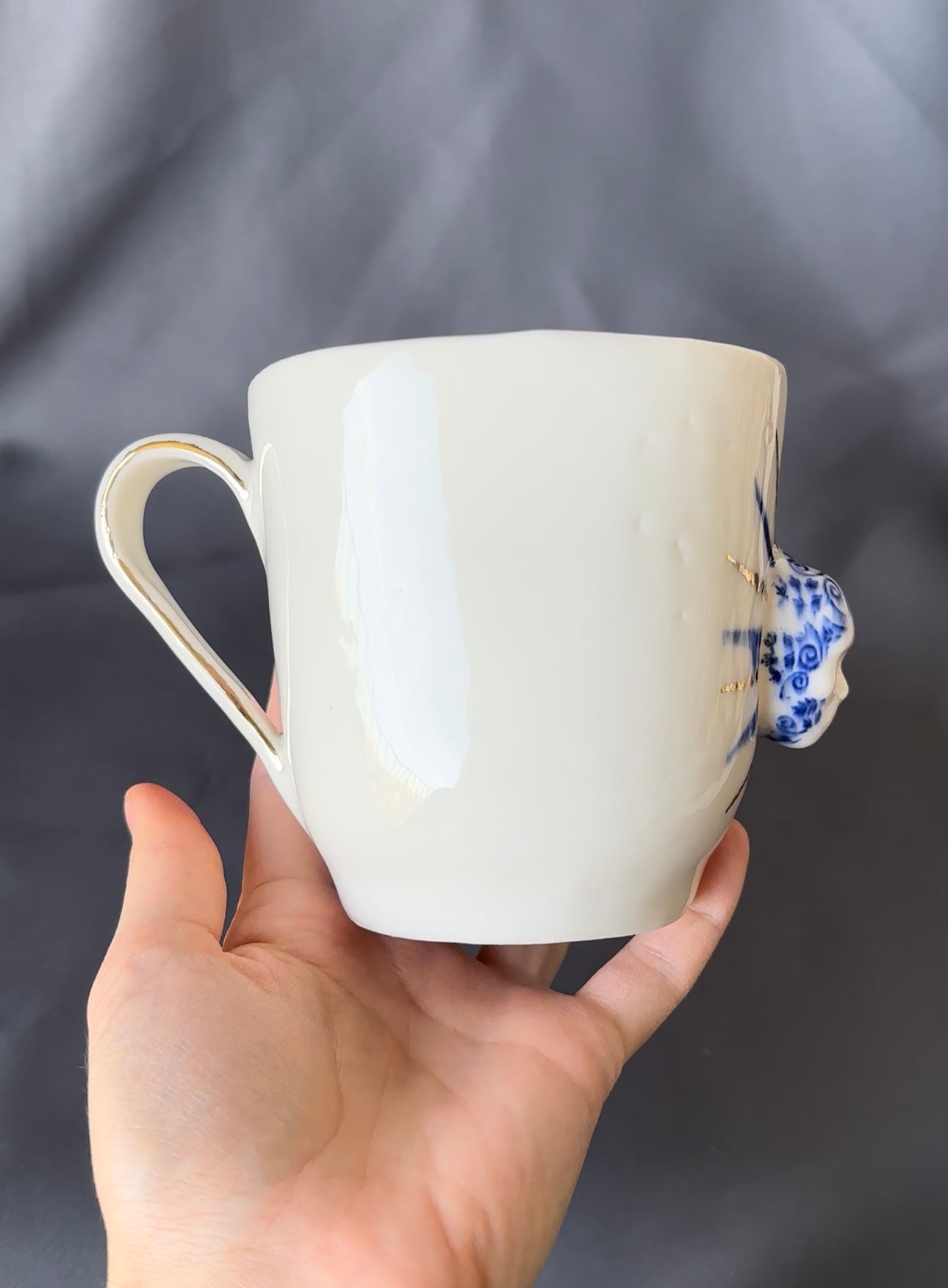 Kubek porcelanowy z główką