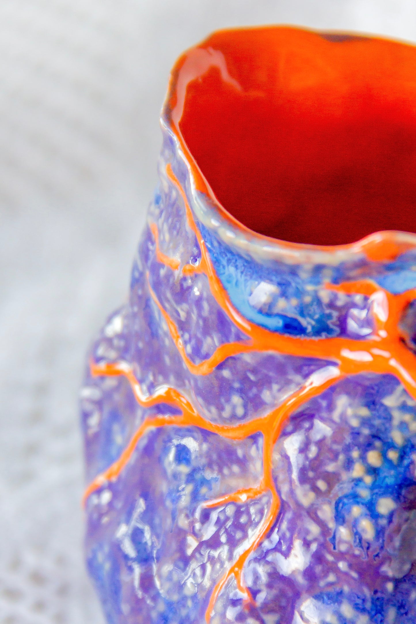 Kubek ceramiczny “Couroupita” fioletowo-pomarańczowy