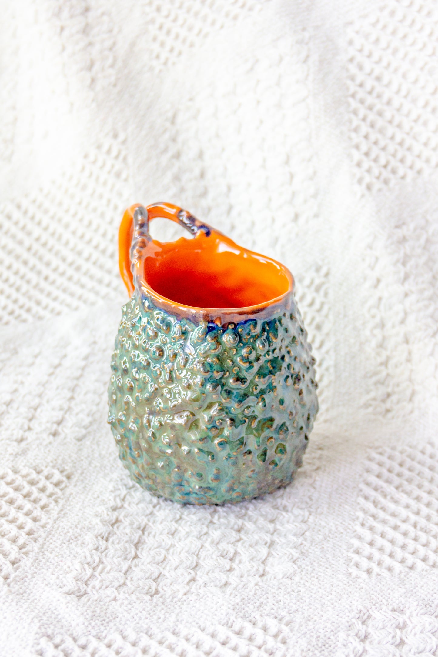 Kubek ceramiczny „Rafflesio” zielono-pomarańczowy