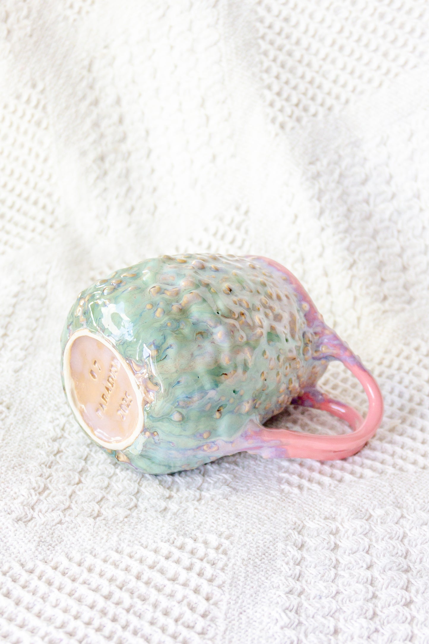Kubek ceramiczny „Rafflesio” zielono-różowy