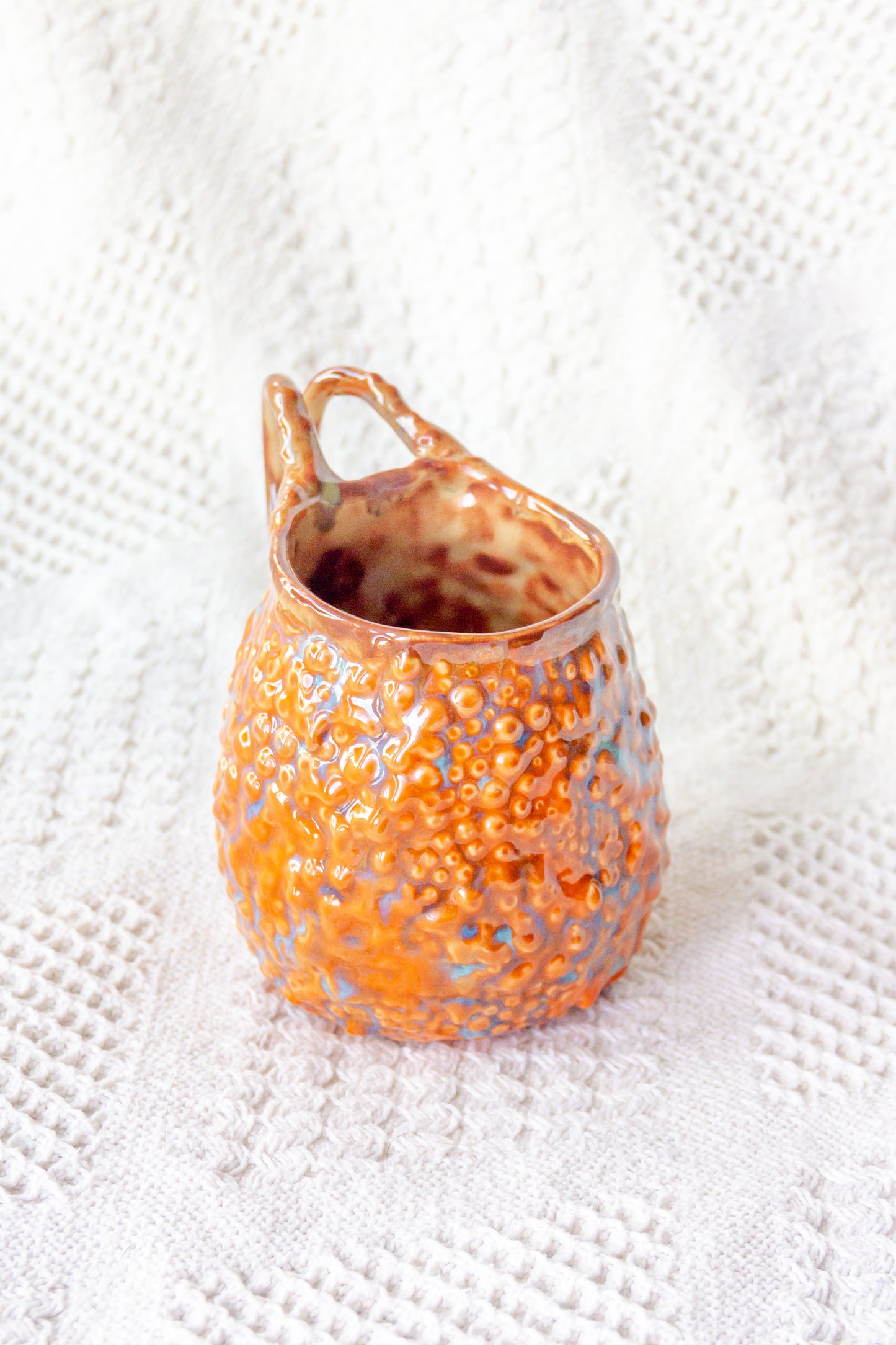 Kubek ceramiczny „Rafflesio” pomarańczowo-brązowy