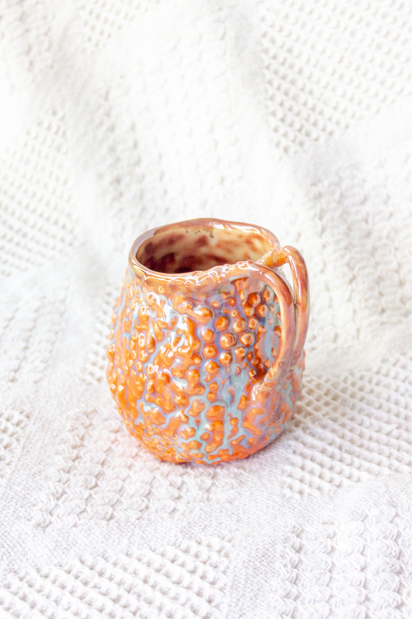 Kubek ceramiczny „Rafflesio” pomarańczowo-brązowy