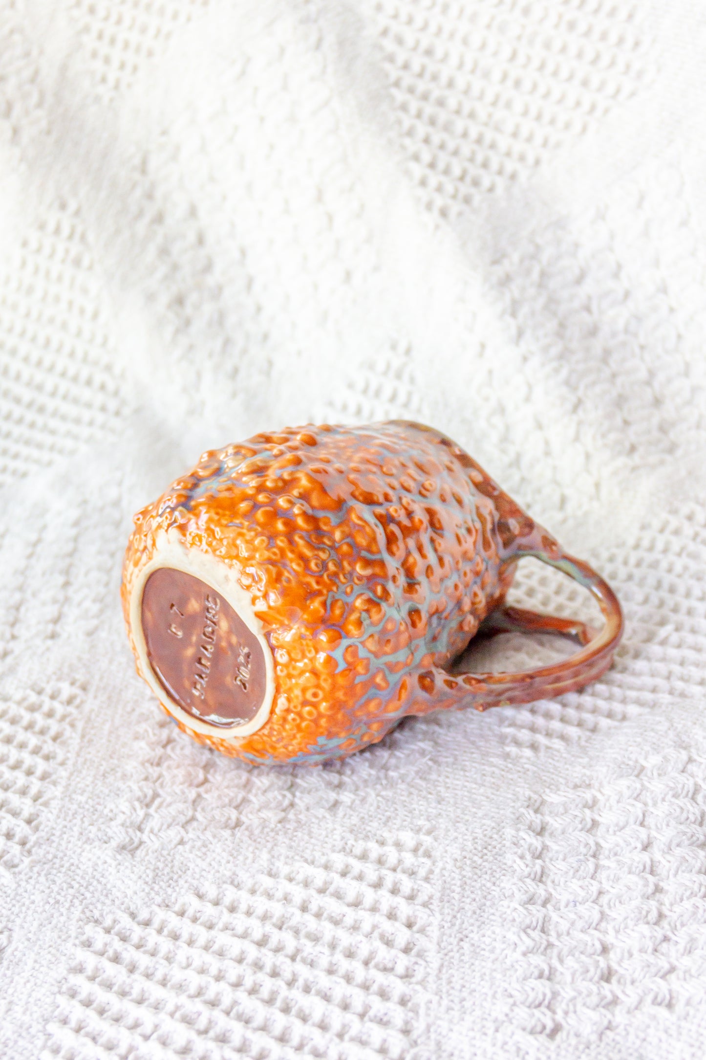 Kubek ceramiczny „Rafflesio” pomarańczowo-brązowy