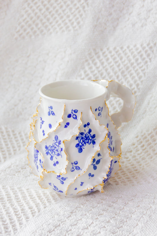 Kubek porcelanowy „Laminari” ze złoceniem