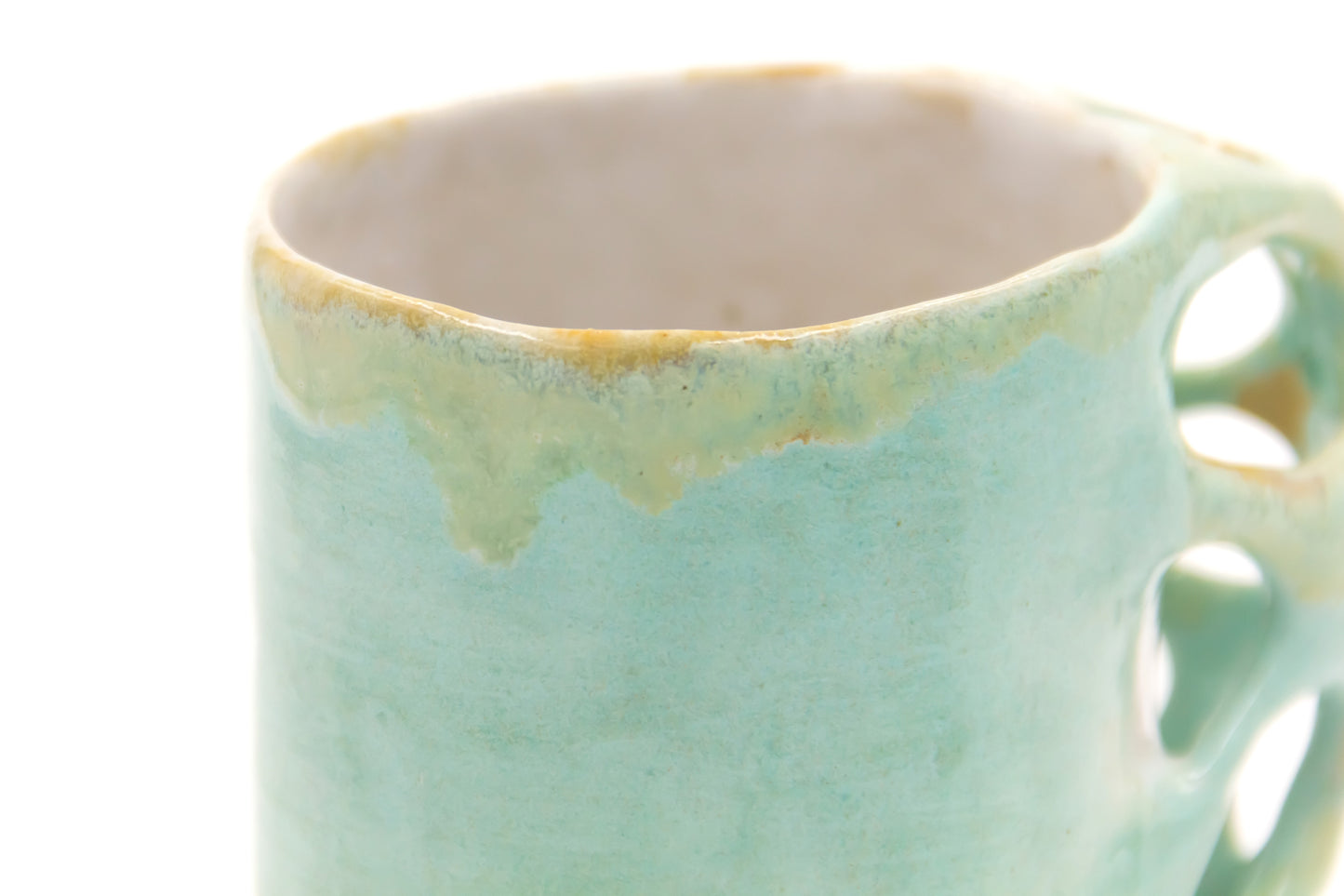 Kubek ceramiczny w kolorze turkusowo-białym