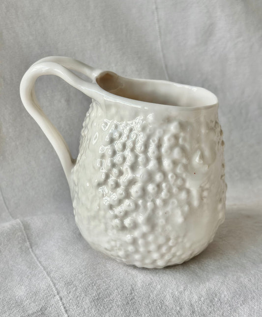 Mug en porcelaine "Rafflesio" avec une fissure