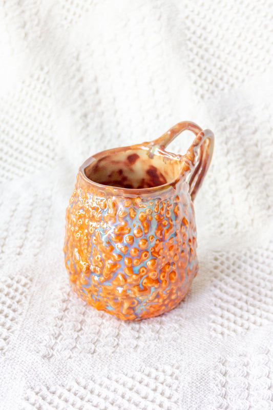 Kubek ceramiczny „Rafflesio” pomarańczowo-brązowy