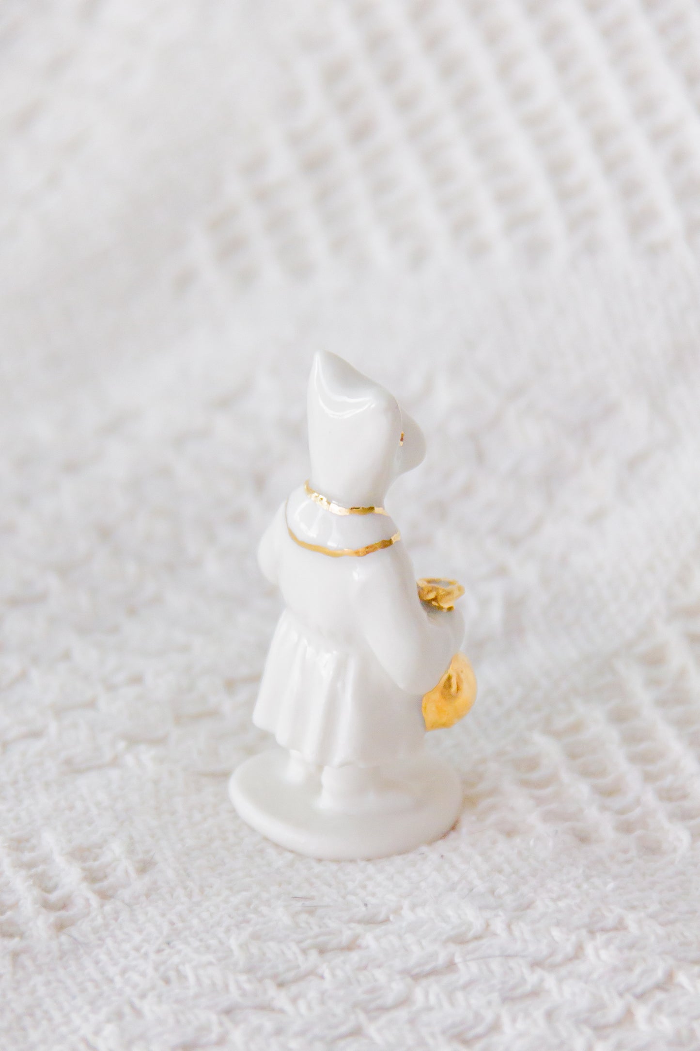 Werling kupiec, rzeźba porcelanowa ze złoceniem