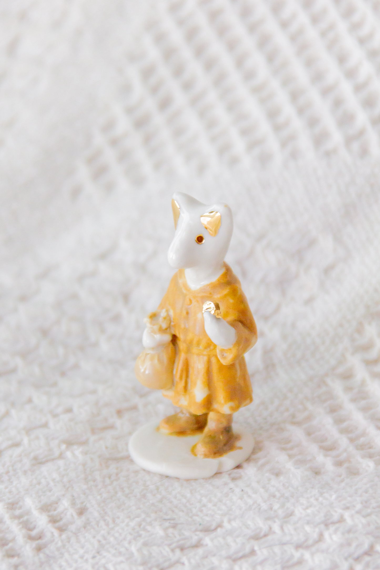 Werling kupiec, rzeźba porcelanowa ze złoceniem