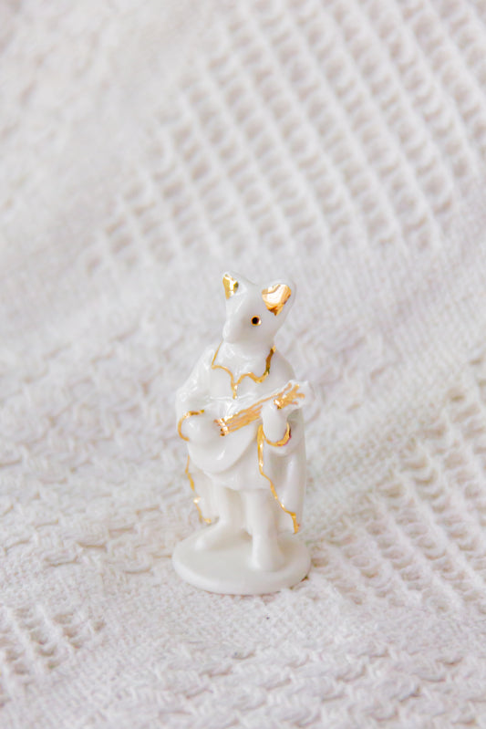 Werling minstrel, rzeźba porcelanowa ze złoceniem