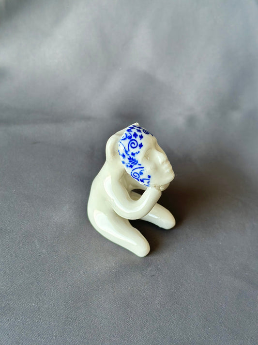 Werling avec masque, figurine en porcelaine