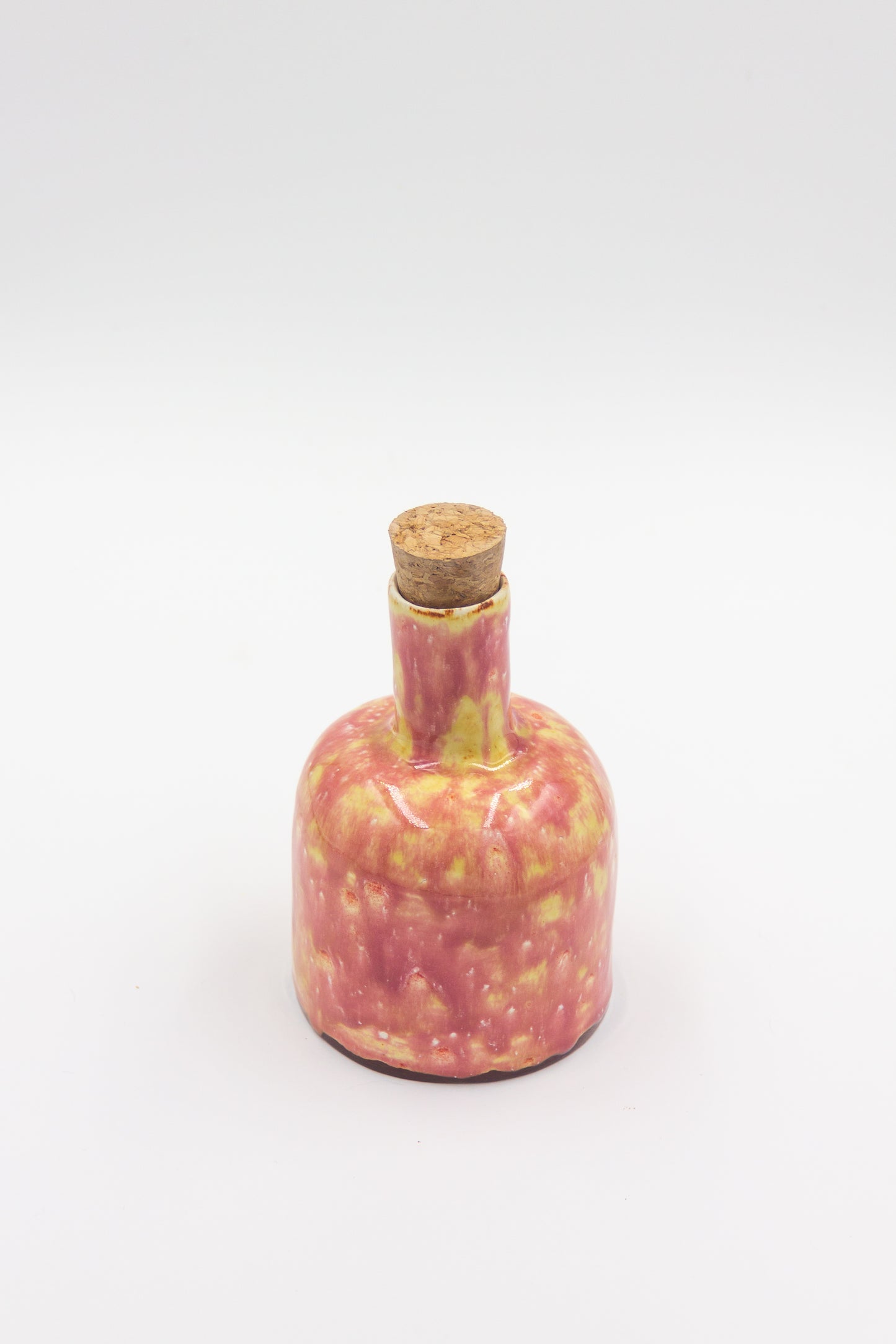 Butelka ceramiczna w kolorze malinow-żółtym